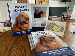 Stack of books by Robert Chipkin titled "Paws To Remember: wit & wisdom of Theo the golden retriever"