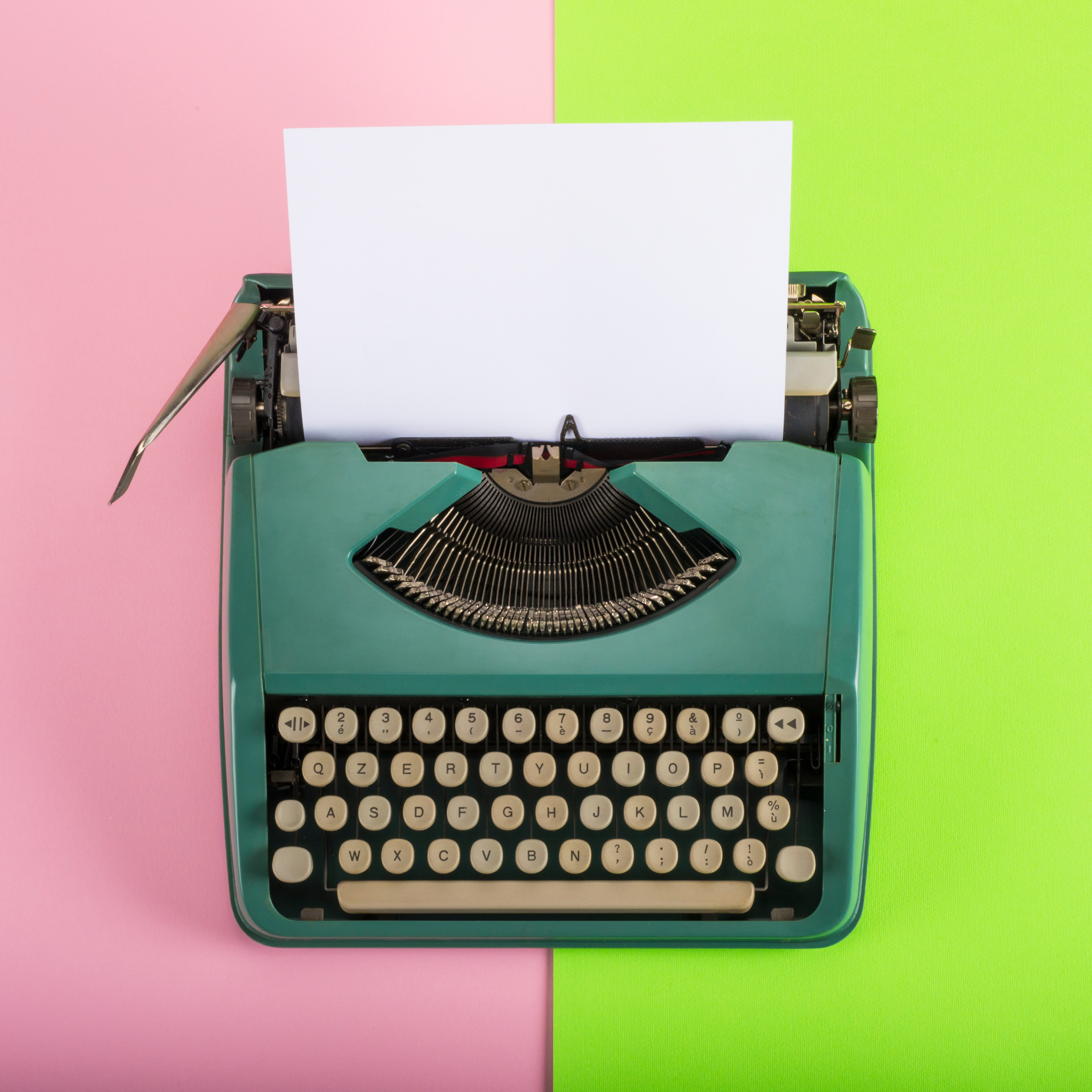 Authors and Writing: Typewriter with pink and green background