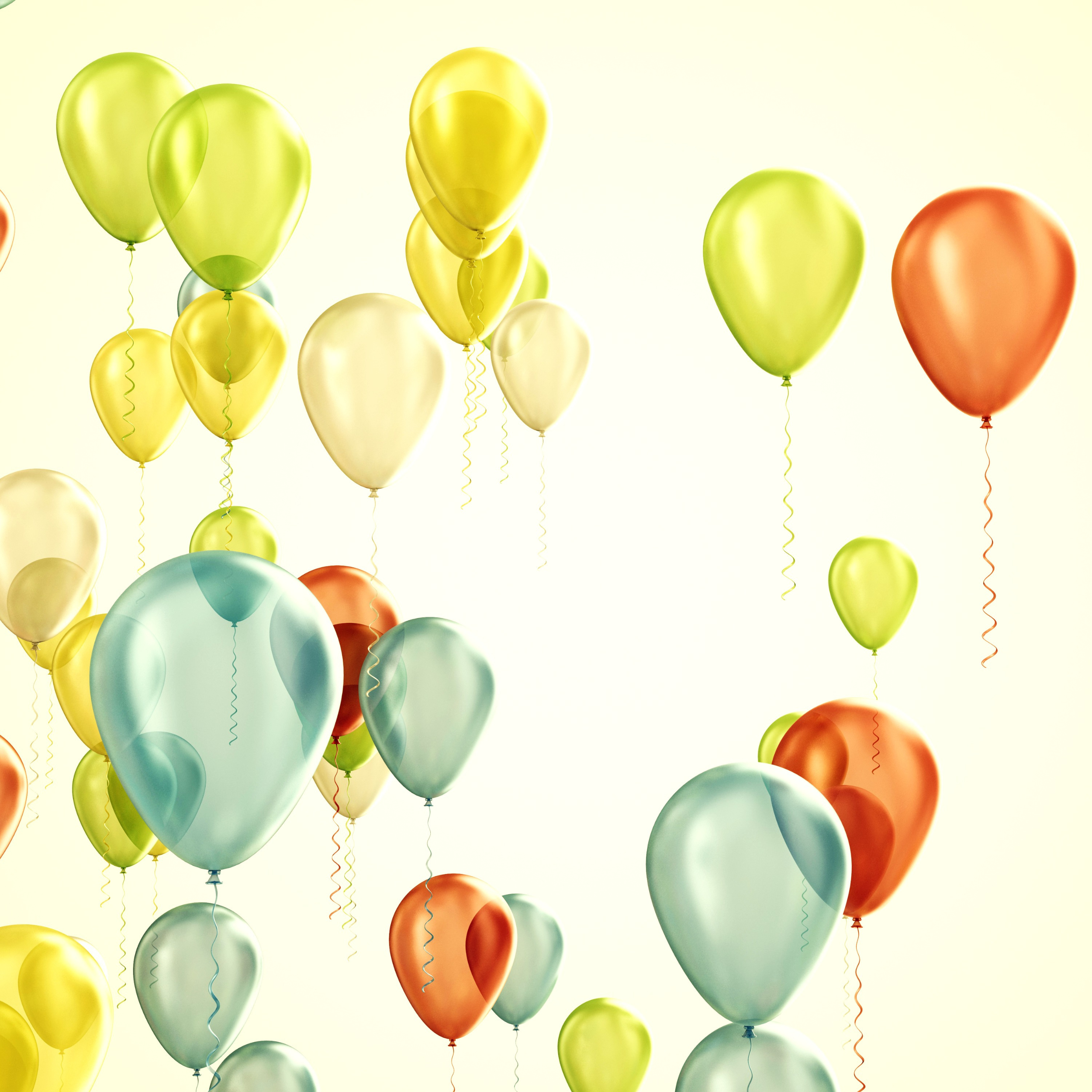 Several balloons that are lime green, turquoise, yellow, and orange