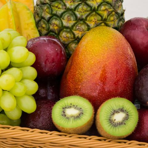 Wooden box holding various fruits