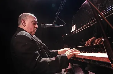 River of Dreams' lead singer, John Cozolino, playing the piano