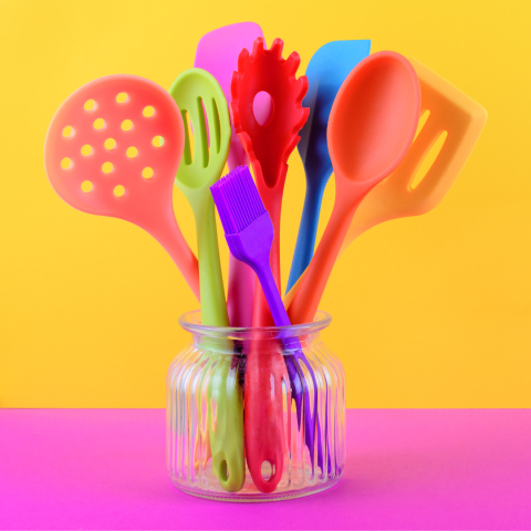 Vibrant picture of silicone spatulas, slotted spoons, and turners