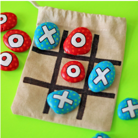 Homemade tic tac toe game, with painted rocks