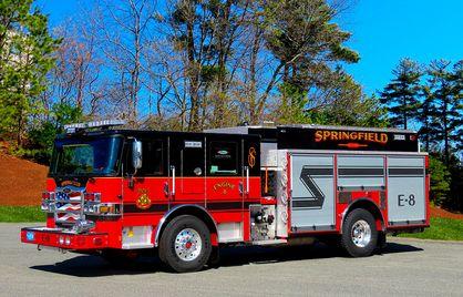 Photograph of a Springfield Fire Department truck with black striping.