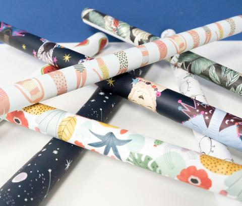 tubes of wrapping paper in different styles and colors