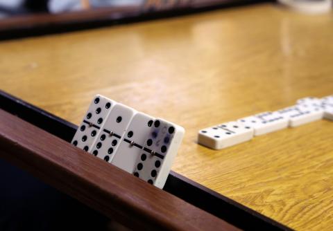 dominoes on a table waiting to play