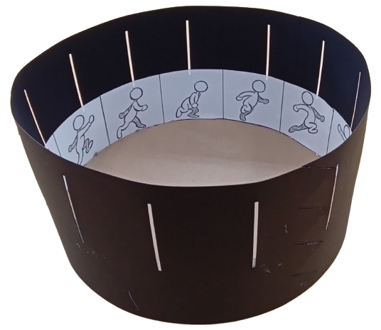 A zoetrope - a cylindrical animation tool - showing a running stick figure