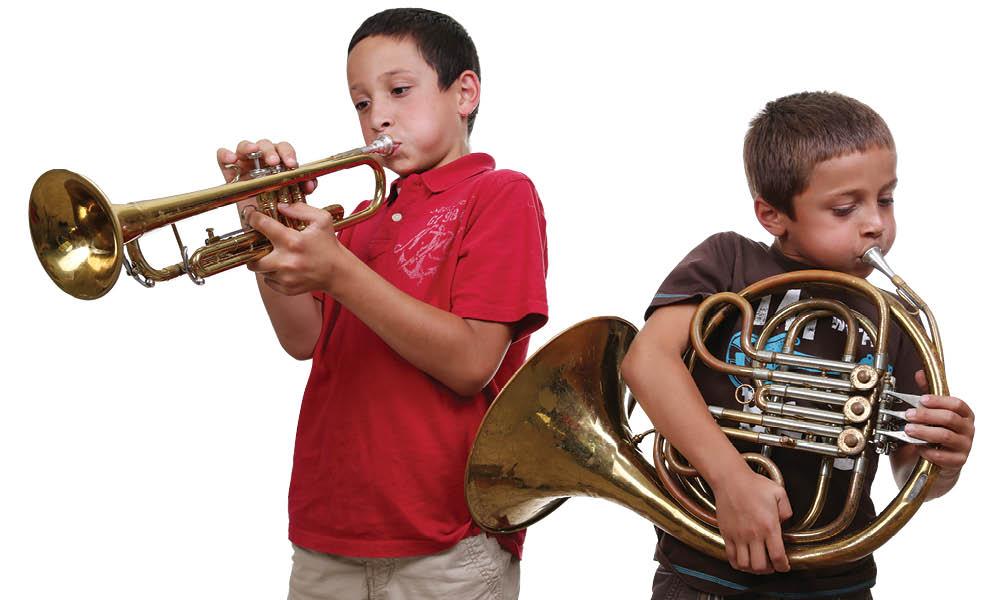 Two children playing horned instruments
