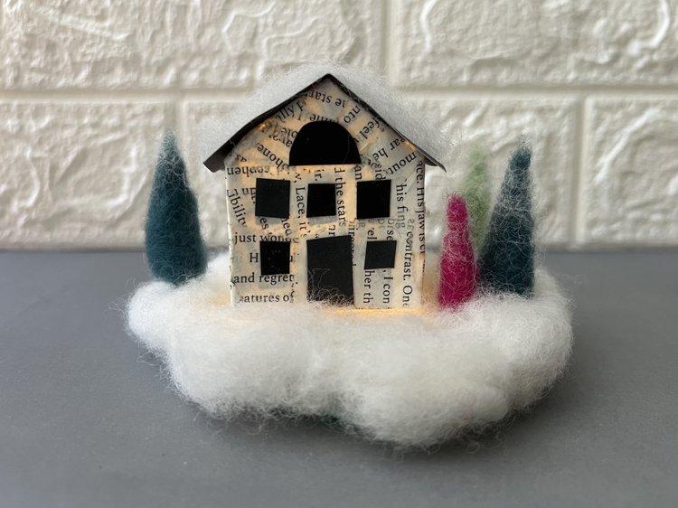 paper house on snowy wool base with felted wool trees